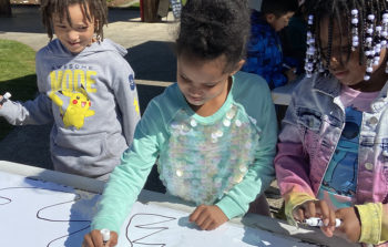 Students from Clear Creek Community work on designing a poster that demonstrates STEAM concepts.