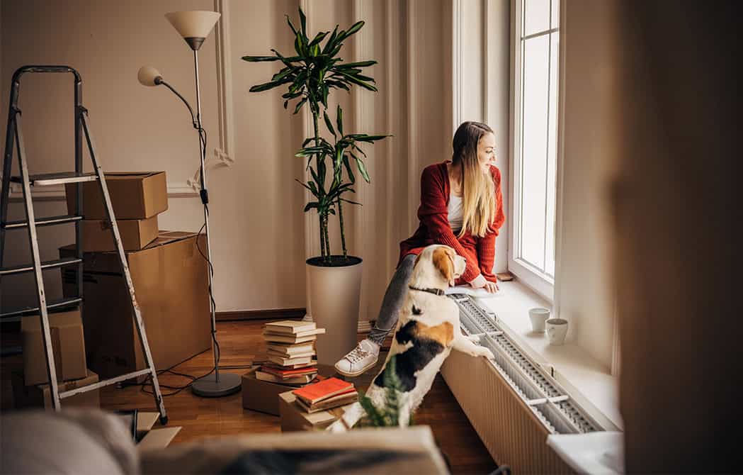girl and dog looking out window in new home onpoint mortgage seminar