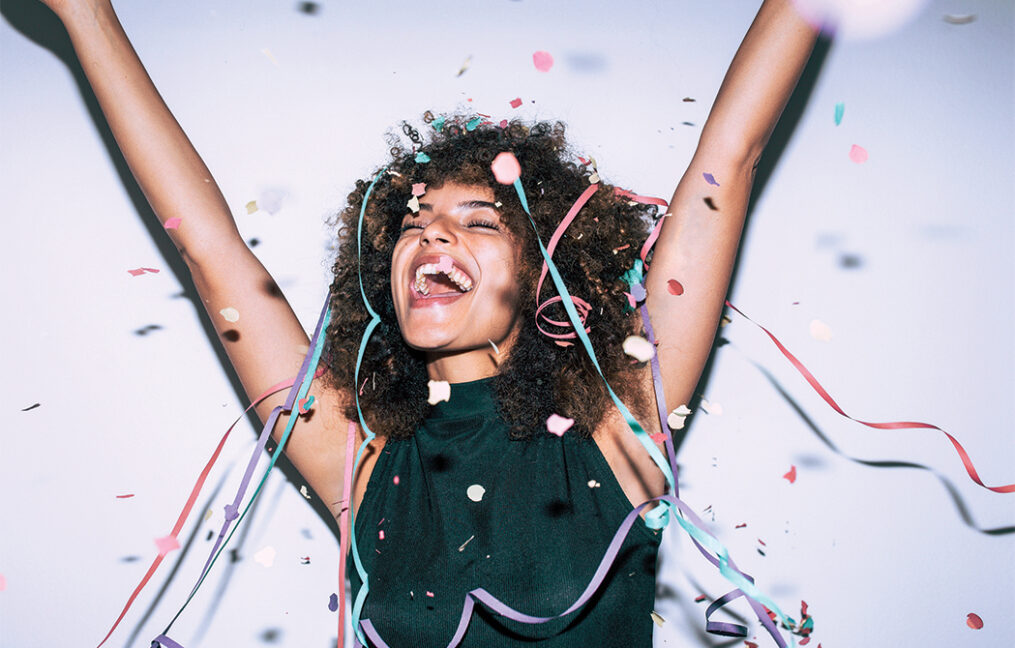 Woman smiling with confetti