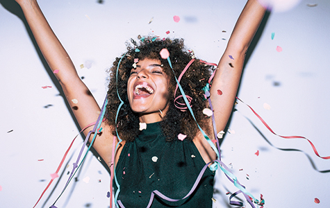 Woman smiling with confetti