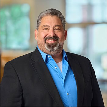 Steve Bartholew OnPoint Mortgage Professional Headshot Bank Back drop