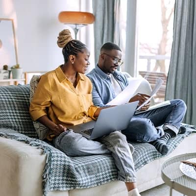 A couple going over mortgage paperwork.