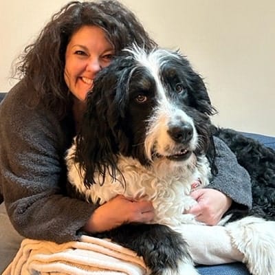 woman hugging her dog