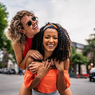 Friends giving piggyback ride