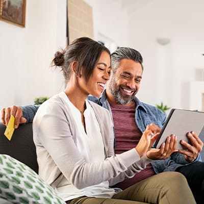 dad-and-daugter-looking-at-tablet-together