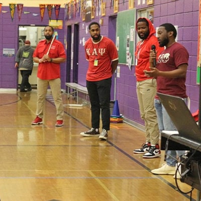 People volunteering at school gym