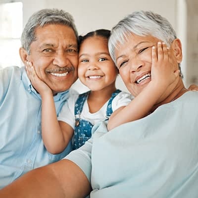 wo-senior-hispanic-grandparents-with-grand-child