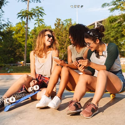 _friends-sitting-down-outside