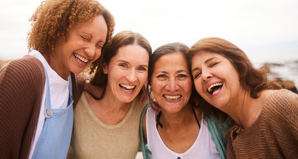 Group of middle-aged women smiling