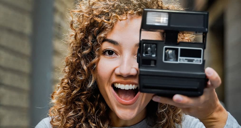 woman-holding-vintage-camera