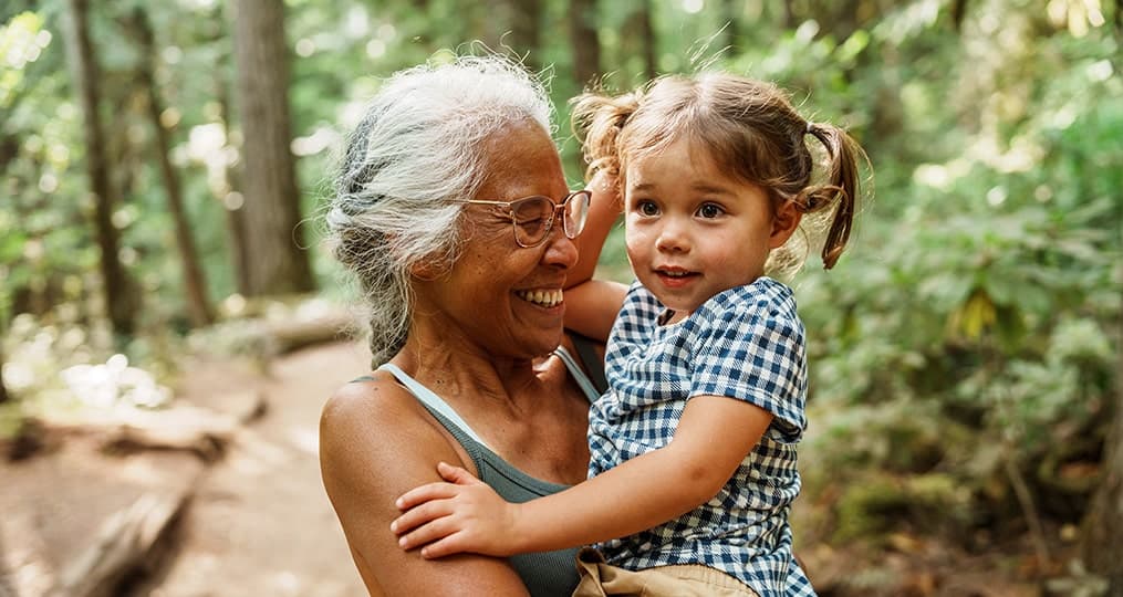 grandmother with a child in her hands