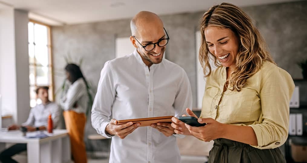 two-people-looking-at-a-tablet