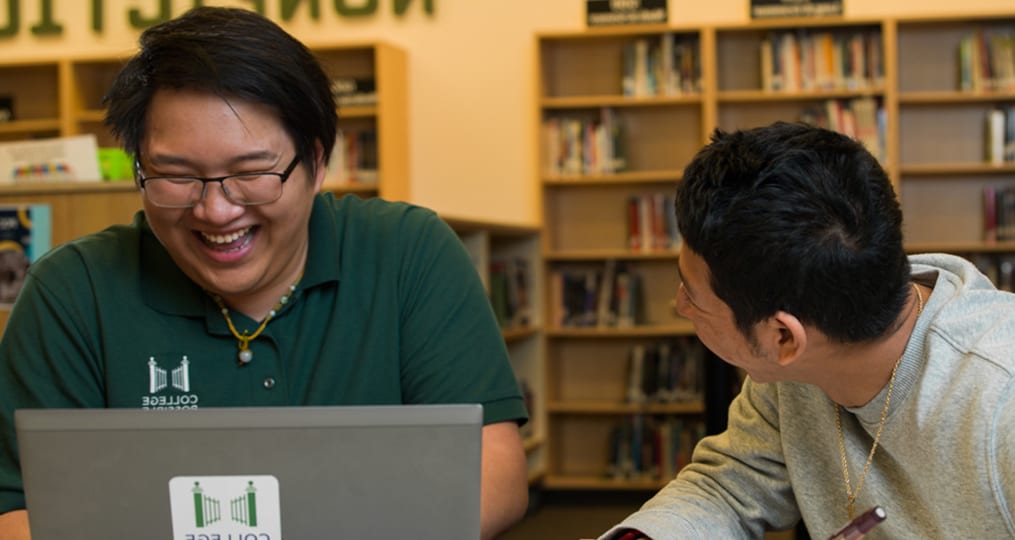 student-being-mentored-in-library