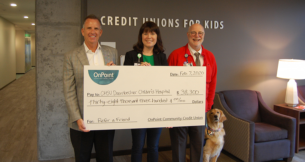 Always Look Up - Support OHSU Doernbecher Children’s Hospital through Refer a Friend_Tory McVay presenting check to OHSU Doernbecher