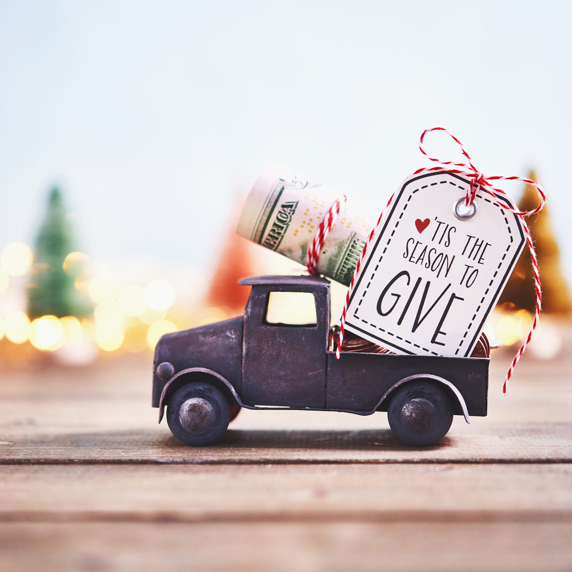 Don't Get Scammed by a Fake Charity This Giving Season_donation money in toy truck
