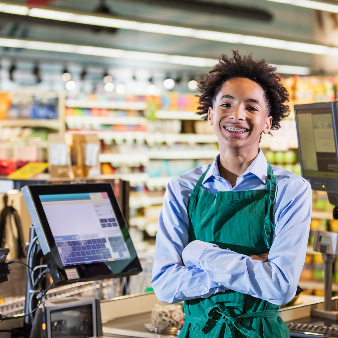 How to Help Teens Budget Their First Paychecks_teen boy working at his first job