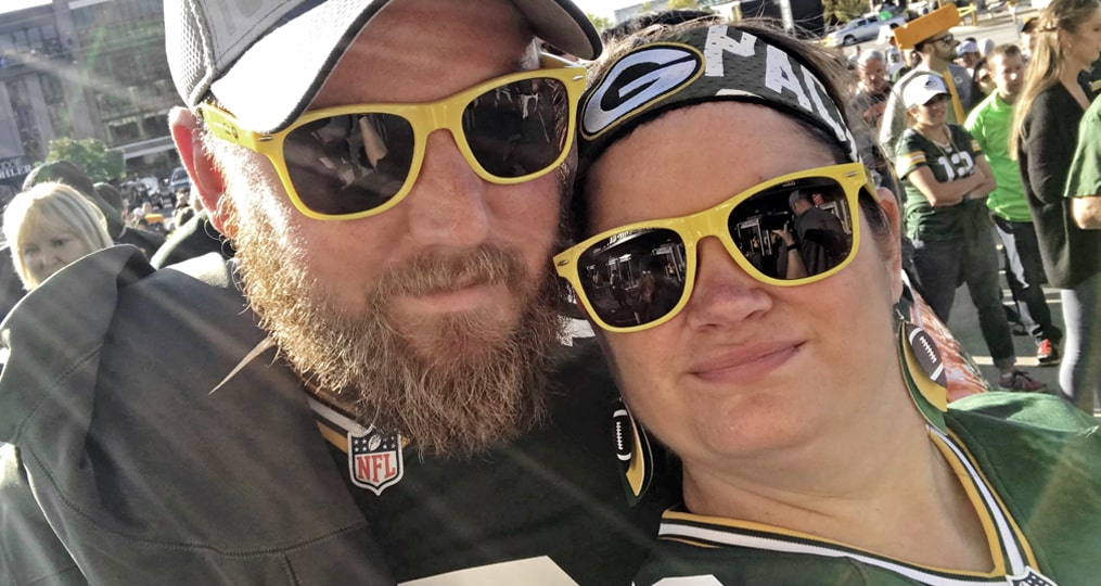 Employee Spotlight with Kristen Gillis-Kristin and husband green bay packers game