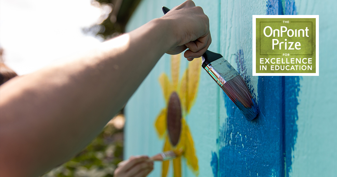 Help Decide the Winner of OnPoint's $5,000 Community Builder Award-hand painting a mural in a garden