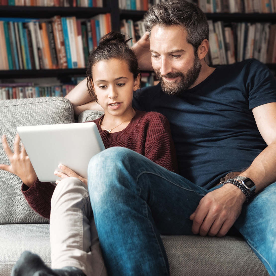 10 Tips to Share with Your Kids About Personal Cybersecurity_Father and daughter talking about cybersecurity