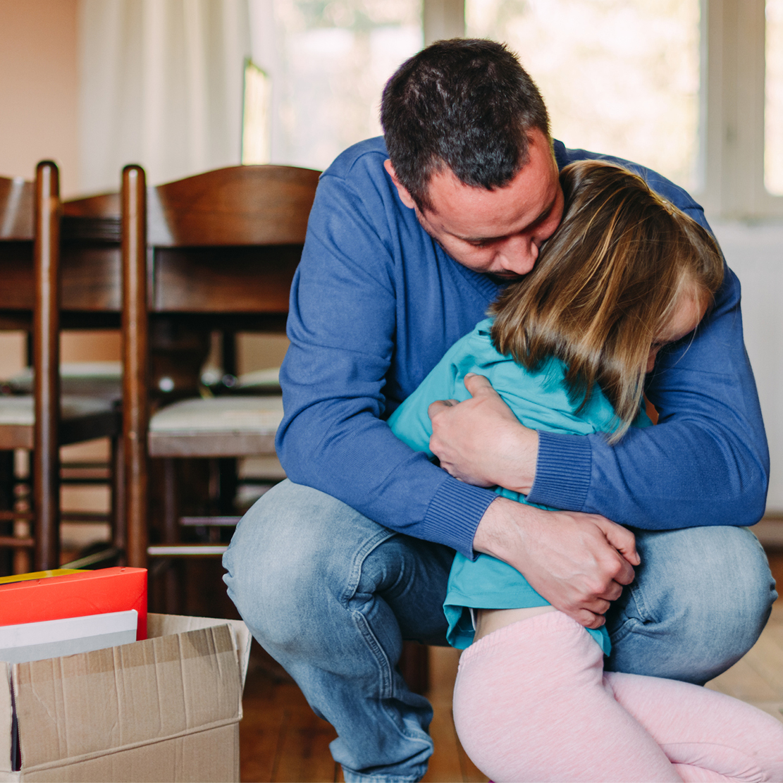 5 Steps to Take If You Lost Your Job in Oregon State_Man hugging his daughter after losing his job