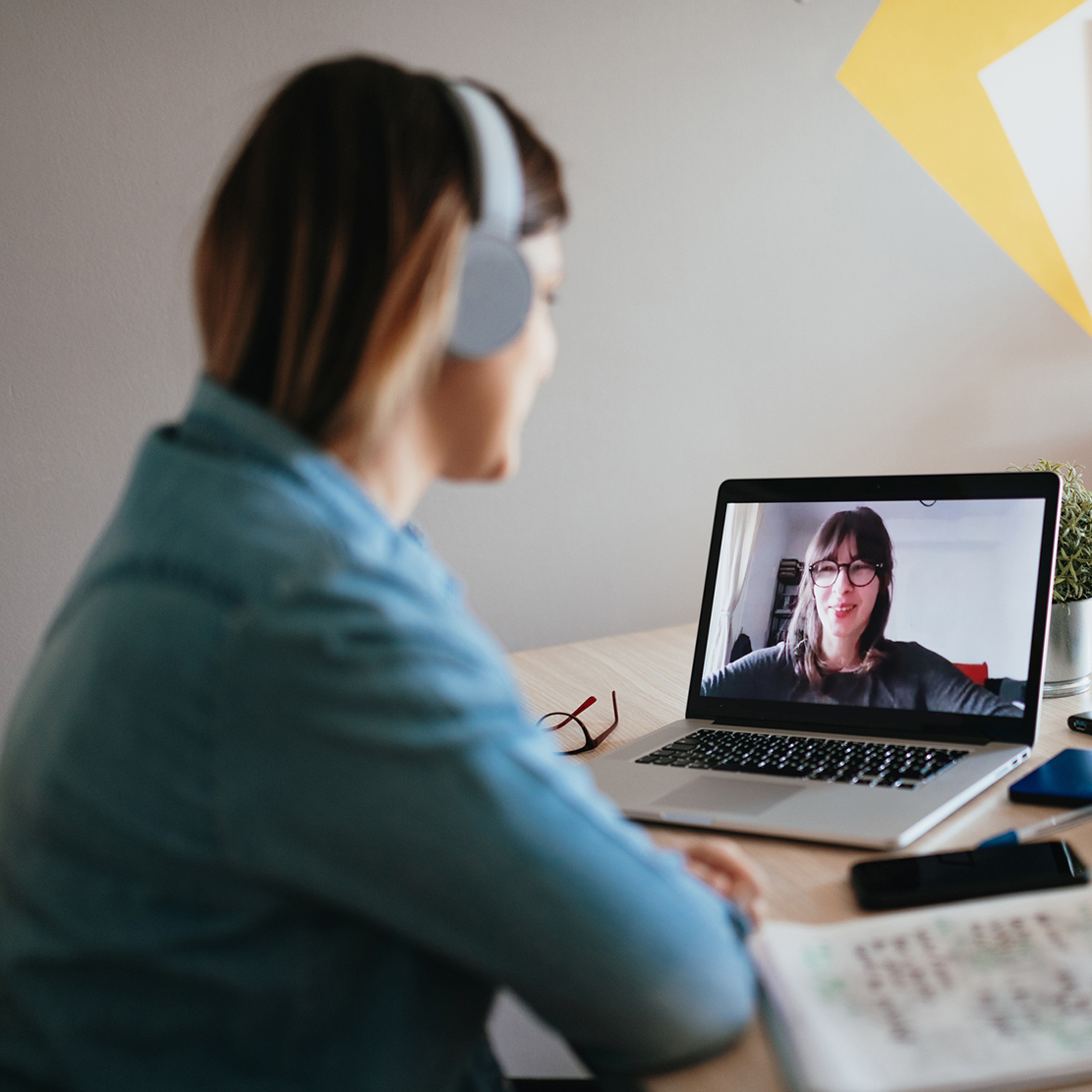 Achieve Your Financial Goals with a Money Buddy_two women talking about finances over video chat