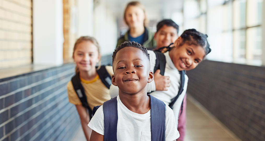 Back to School Savings Lessons for Students and Parents from Xiomara Olvera_Children social distancing with backpacks