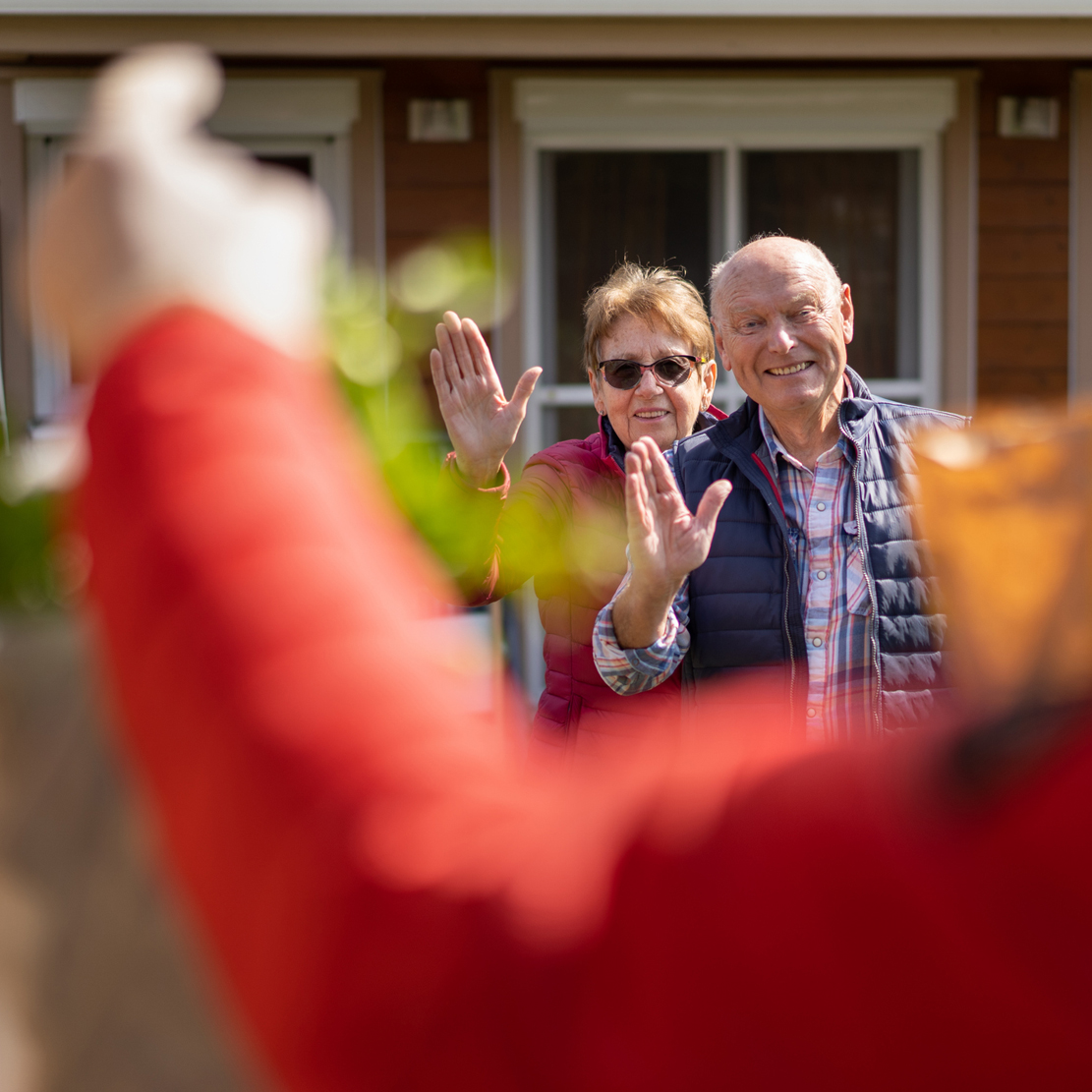 Catch the Wave of Generosity on GivingTuesdayNow_An elderly couple receiving groceries from their neighbor