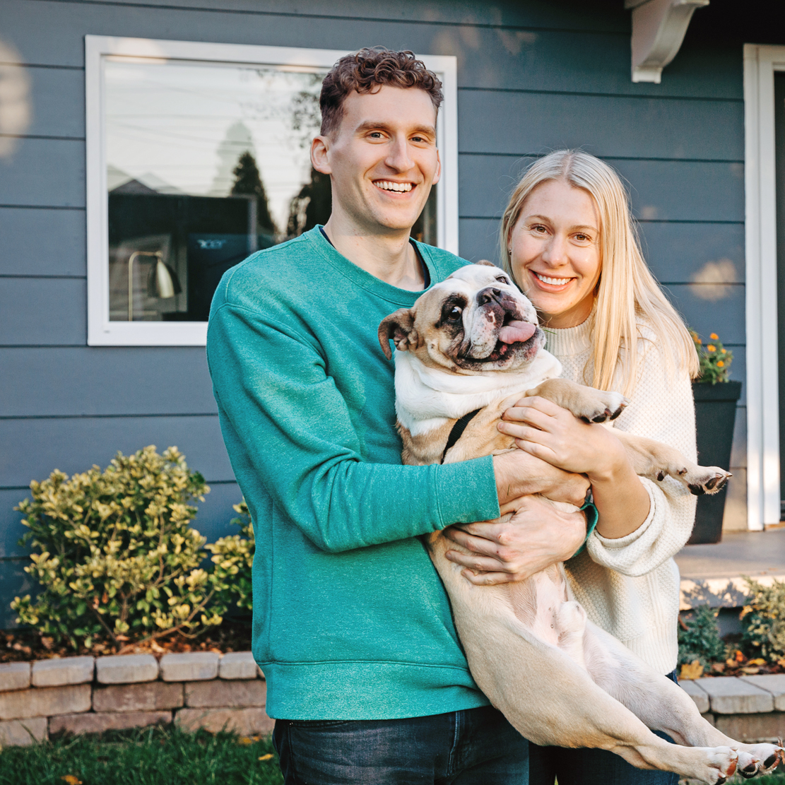 Employee Spotlight with Dannielle Stuart_Dannielle and Eric in front of their house