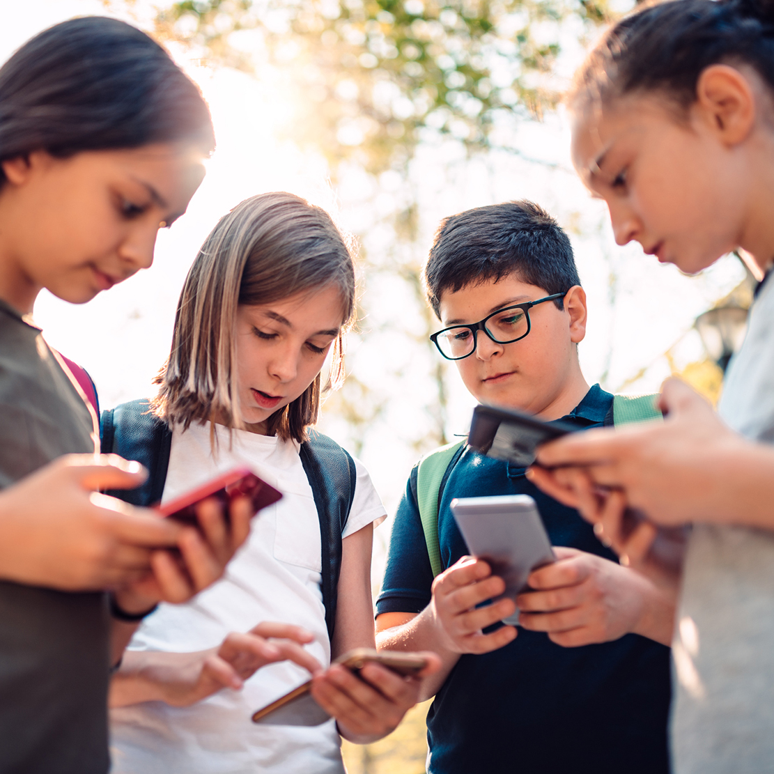 Essential Tips for Securing Your Family's Mobile Devices_Kids using smartphones after school