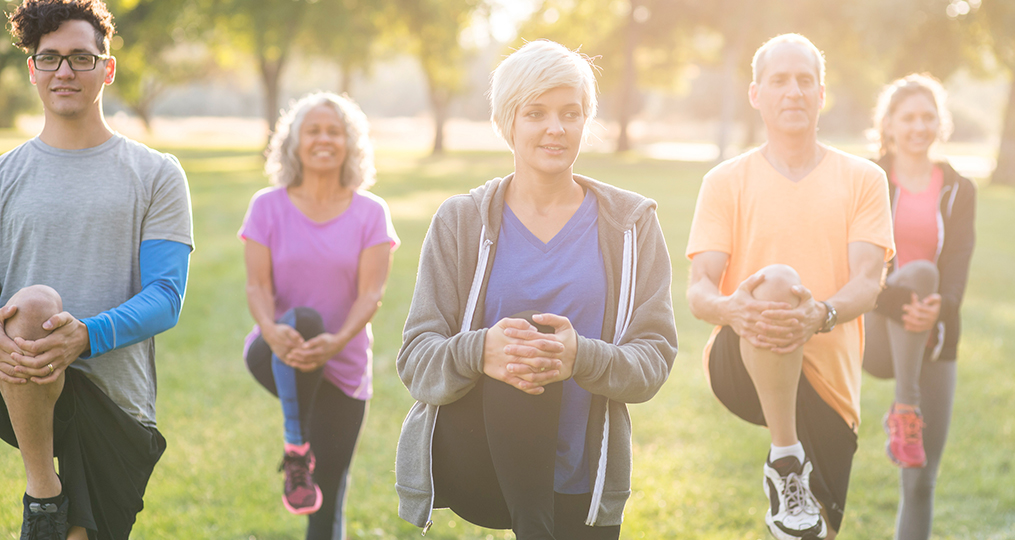 How to balance retirement savings with childs education_group of people working out in the park