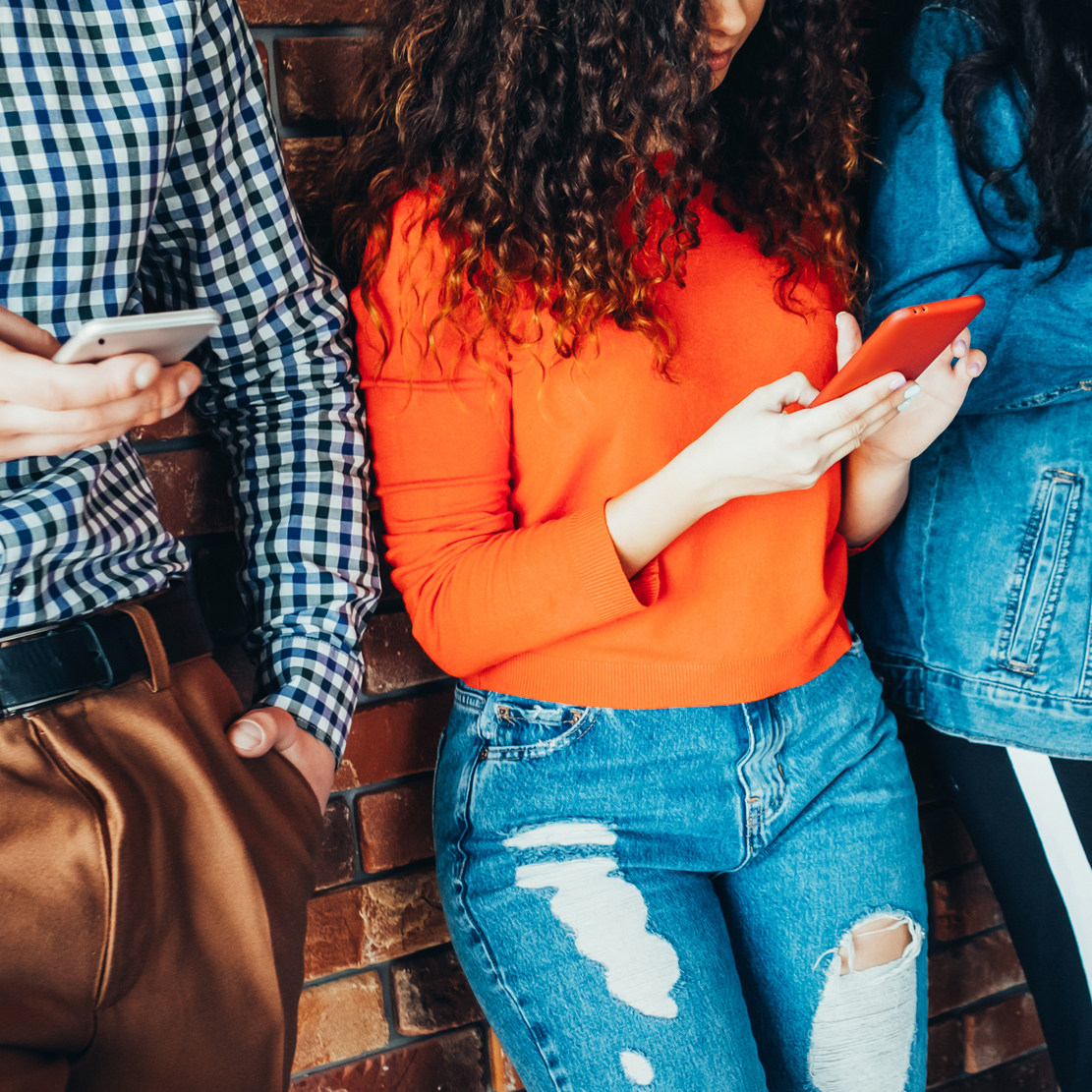 how to safely accept mobile payments_group of strangers holding their phones