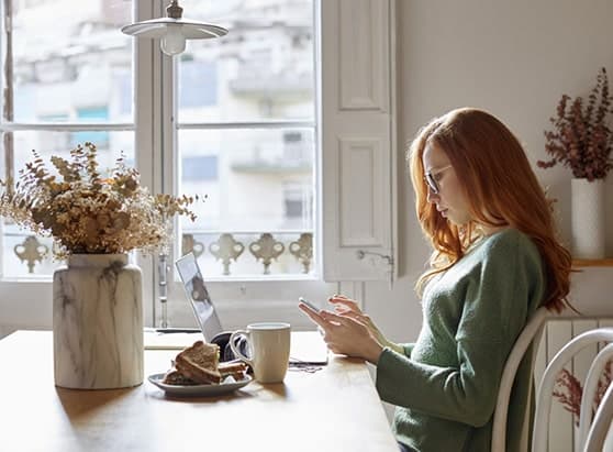 10-Steps-to-Take-If-Your-Personal-Information-Is-Stolen_woman-researching-her-personal-accounts-in-her-kitchen