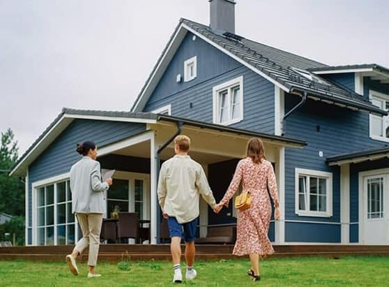 How-Much-Home-Can-You-Afford_-couple-looking-at-a-house-with-agent