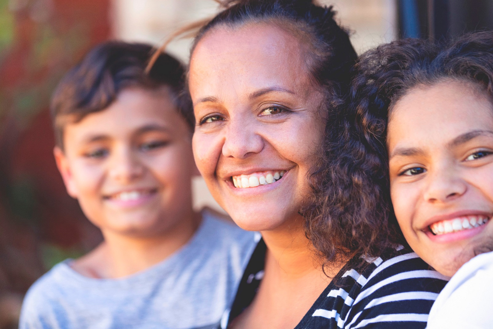 Raphael House_mother smiling with her two children