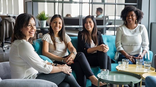 What-Happens-to-My-401k-When-I-Switch-Jobs_middle-age-woman-sitting-with-her-new-team-in-a-creative-space_540x300-min