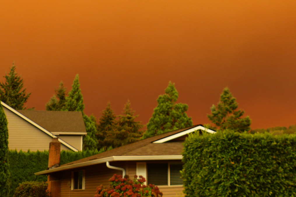 emergency preparedness and disaster planning in the pacific northwest_fire clouds over rooftops