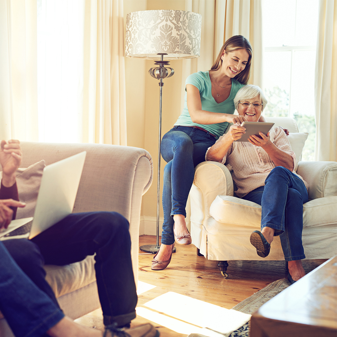 two generations discussing finances in their living room