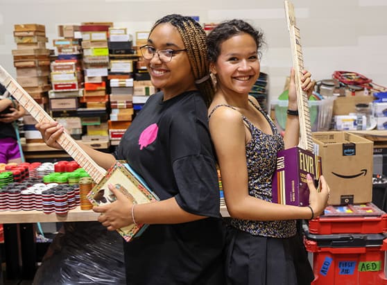 two-girls-holding-self-made-guitars