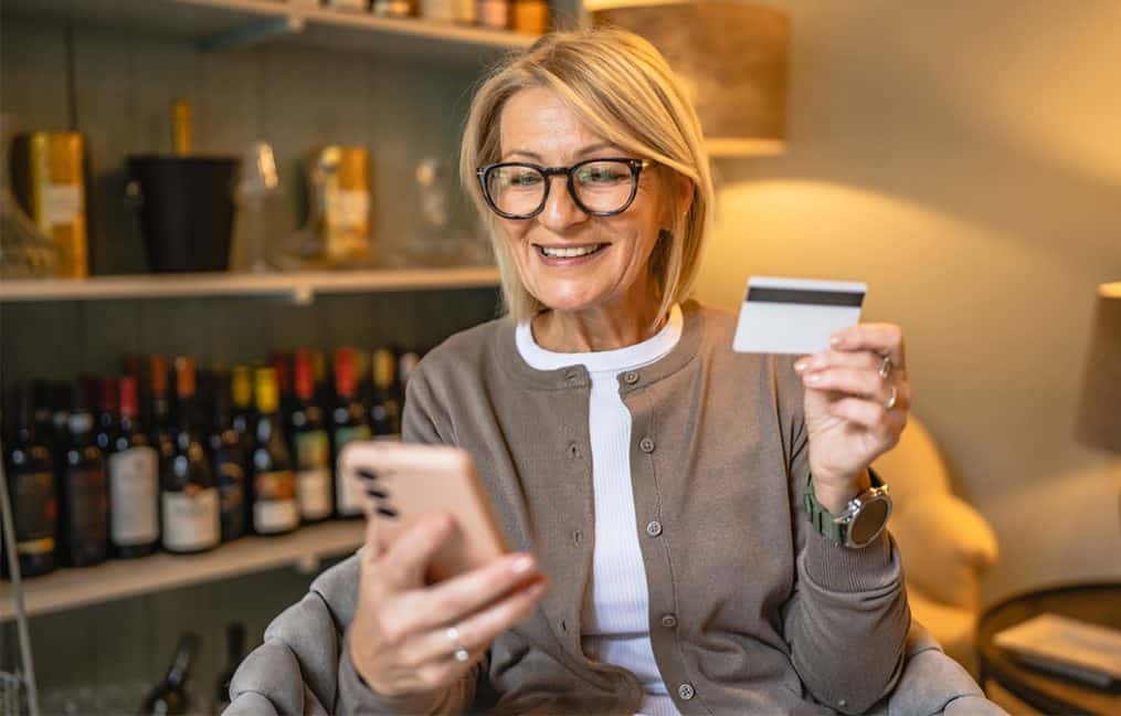 small business owner wine cellar paying bills with credit card onpoint business credit cards.