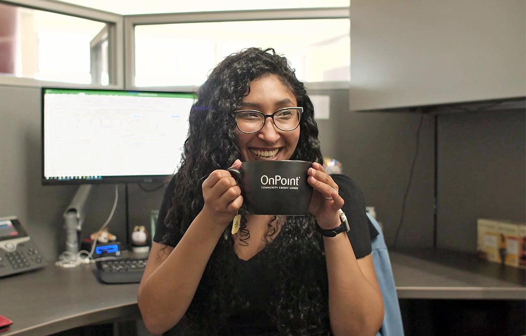 vanessa holding OnPoint mug