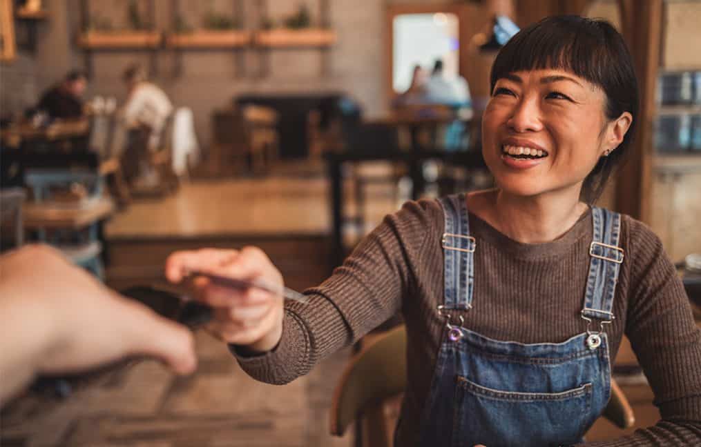 women in overalls paying for food sw washington checking accounts onpoint