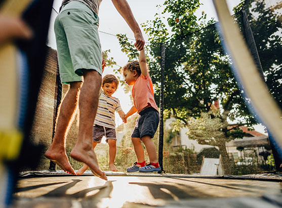 kids jumping on a trampoline