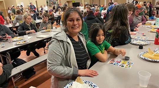 Woman and daughter playing loteria