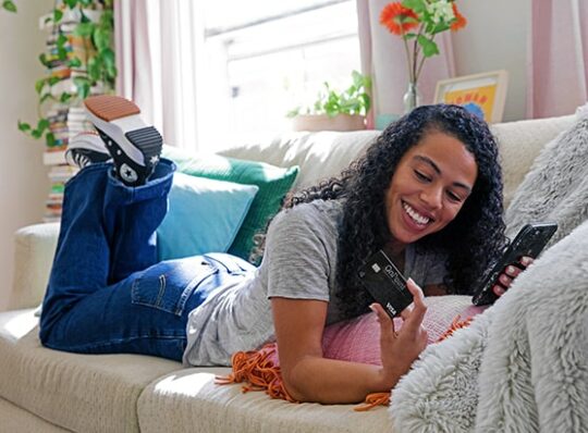 Credit Card Landing Page-young woman making an online purchase with her OnPoint Visa Signature Credit Card