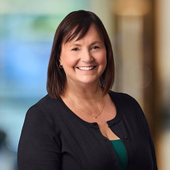Adrienne Crosser OnPoint Mortgage Professional Headshot Bank Back drop