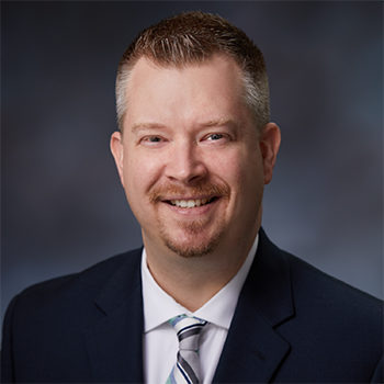 Studio Portrait of Chris Dennett