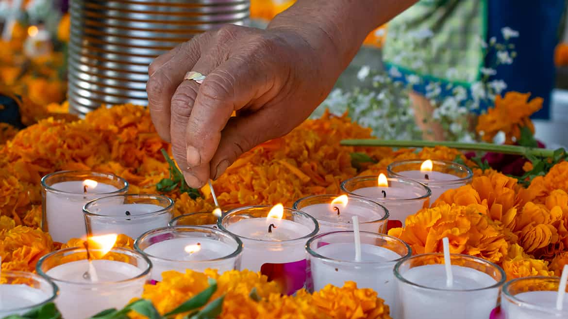 hand-lighting-up-candles