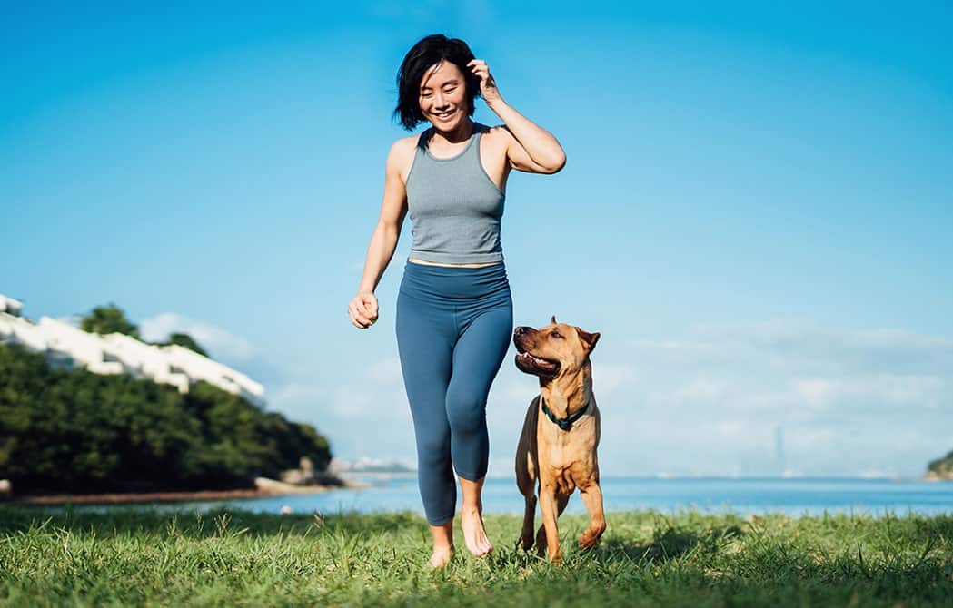 woman-hiking-with-dog