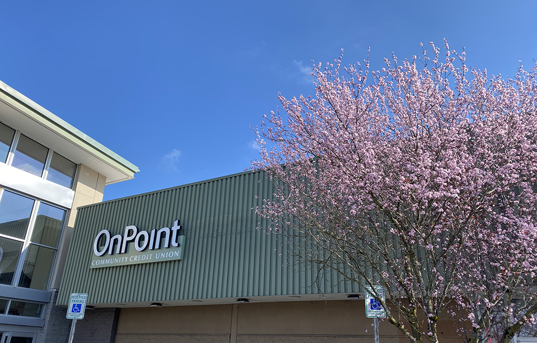 Exterior of East Gresham OnPoint Branch at Fred Meyer with cherry blossom tree in foreground