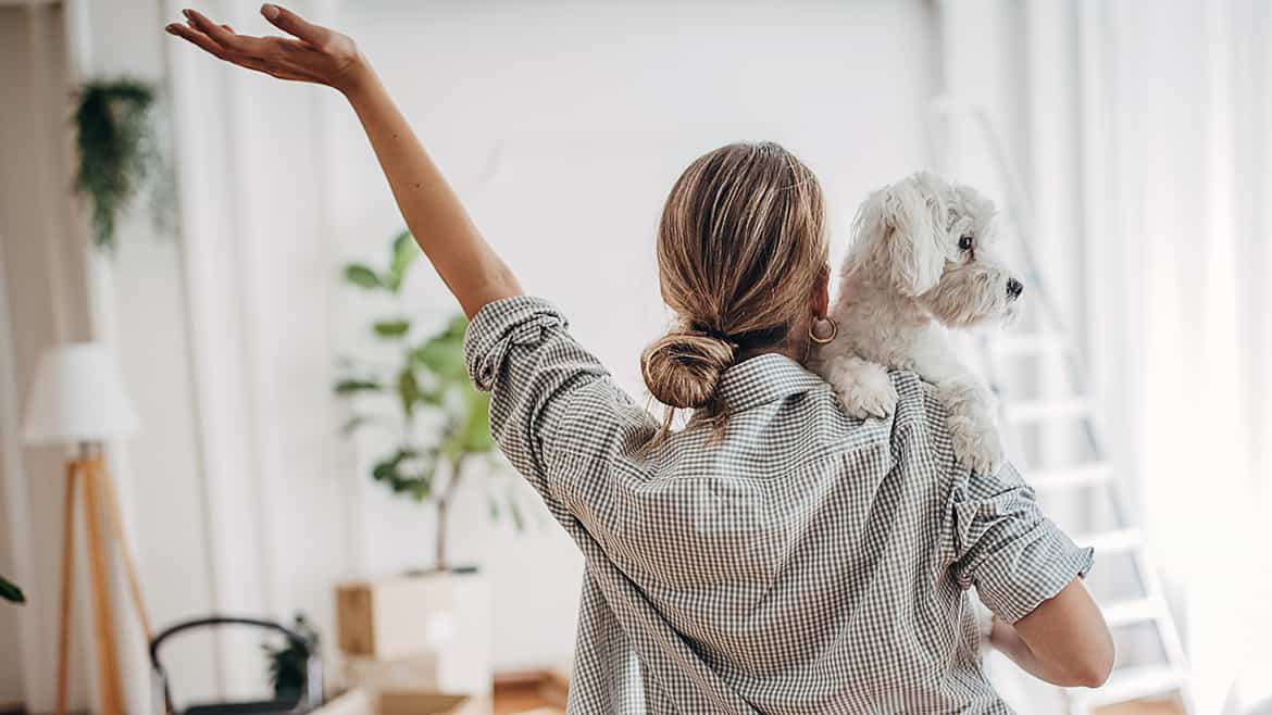 Woman in new home with dog